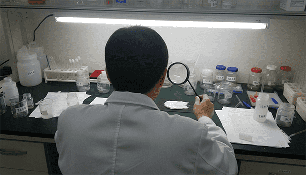 German laboratory technician inspecting cosmetics