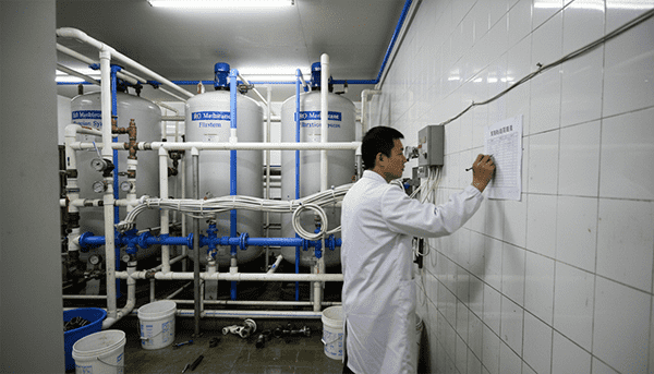 auditor checking documents in warehouse