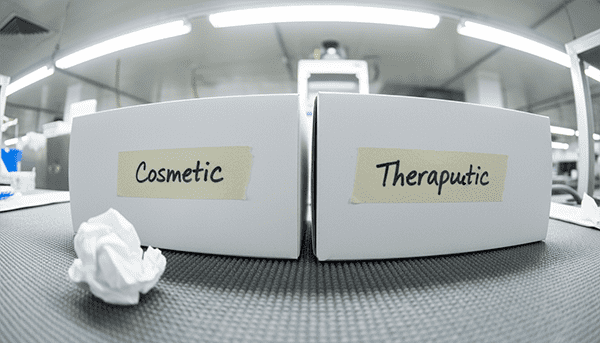 An image showing two product boxes: one labeled "Cosmetic" with beauty claims, the other "Therapeutic" with medical claims