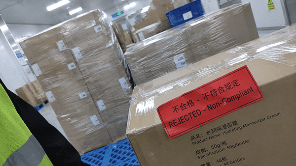 A warehouse full of products with red "REJECTED" stamps on them.