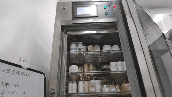 Freeze-Thaw and Heat Stability Testing An image showing a cosmetic jar with cream inside, placed in both a freezing and a hot environment to illustrate temperature stress testing.