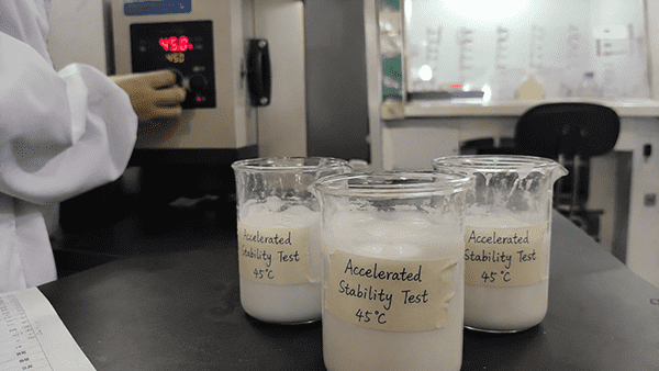 Laboratory glassware, such as beakers and test tubes, representing product testing and analysis.