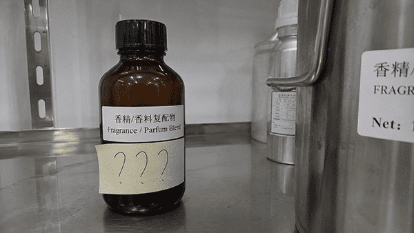 A black box labeled "Fragrance/Parfum" with question marks coming out of it.