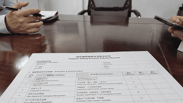 A brand owner in a meeting with a cosmetic manufacturer