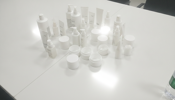 A collection of different cosmetic packaging like jars, pumps, and tubes
