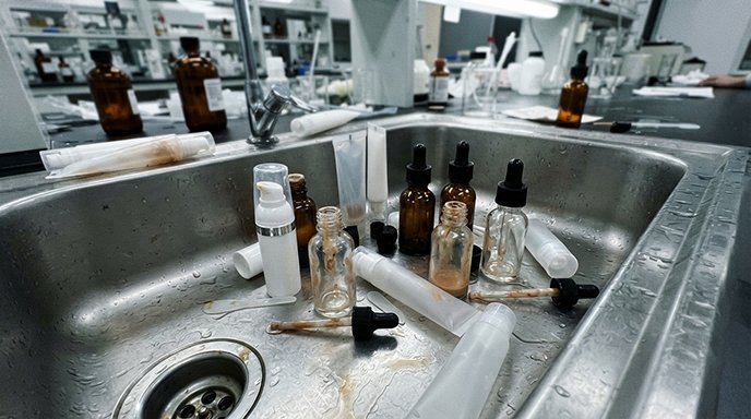 Lab technician performing a preservative efficacy test (PET)