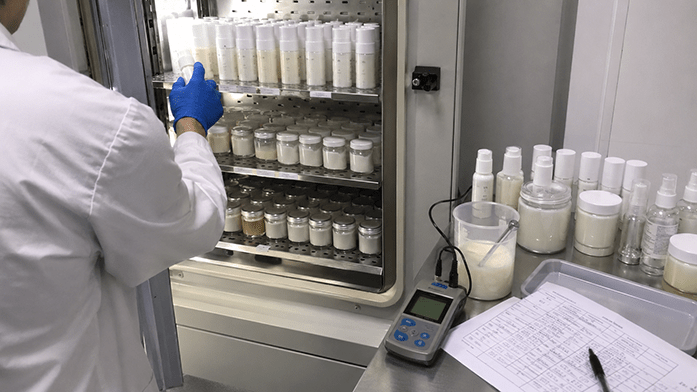 laboratory bench with stability test samples stored in climate chambers, iPhone-angle snapshot
